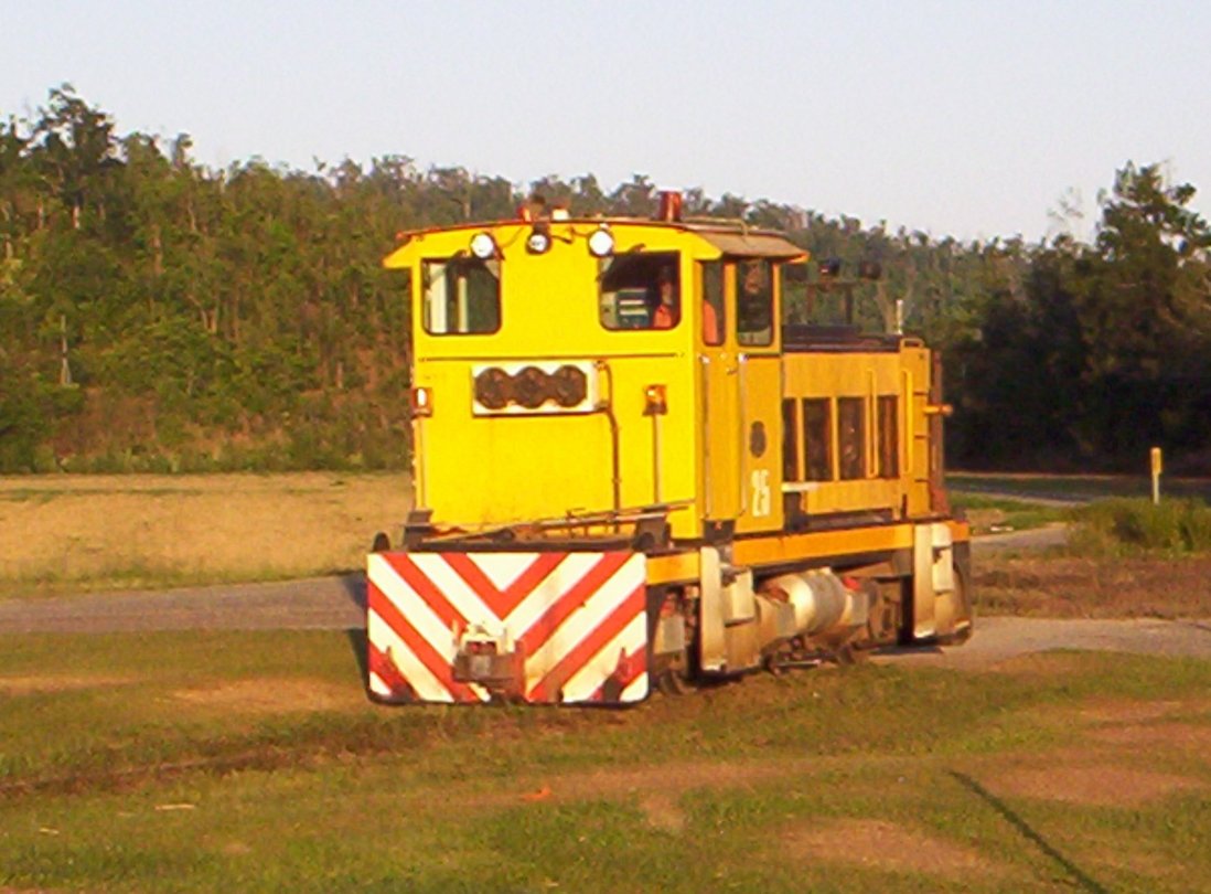 In a setting sun, #25 about to cross the Bruce Highway on Top Line. Oct-07.