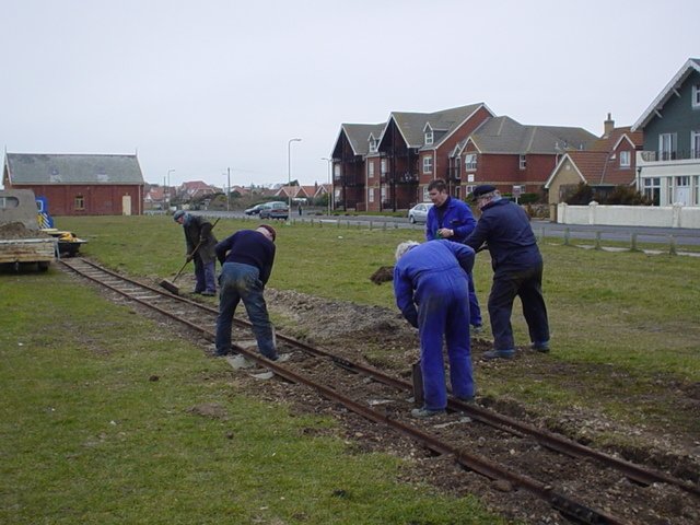 Ballasting the track.