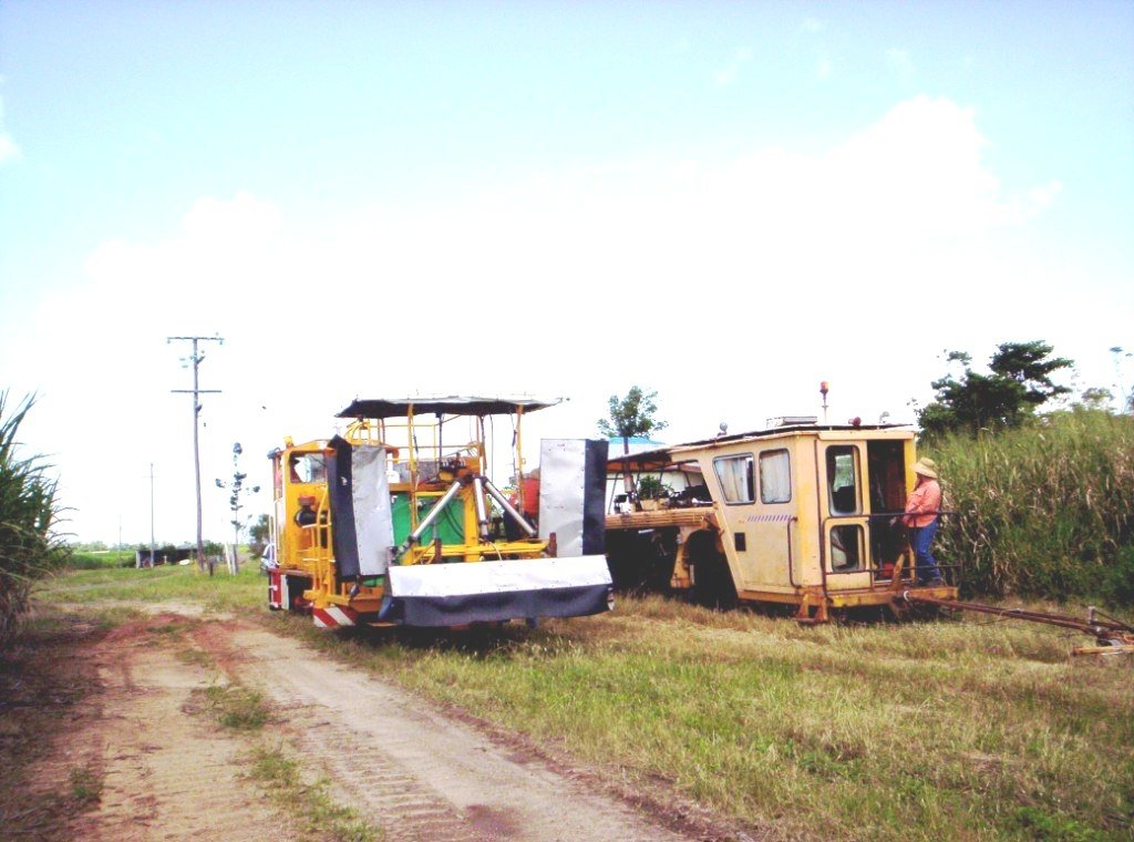 The weed spray train and the Plasser Tamping Machine cross at Cowley, Mar-07.