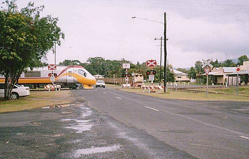 A Tilt Train crosses the 610mm cane line at Silkwood