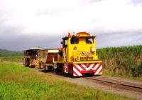 #22 tows the Ballast Hopper, Ballast plow, and the Plasser tamping Machine between jobs. April-07.