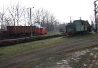 The train departs from the interchange sidings. A derelict Px48 (one of the few remaining items of a once attractive open air railway museum) is in the foreground.